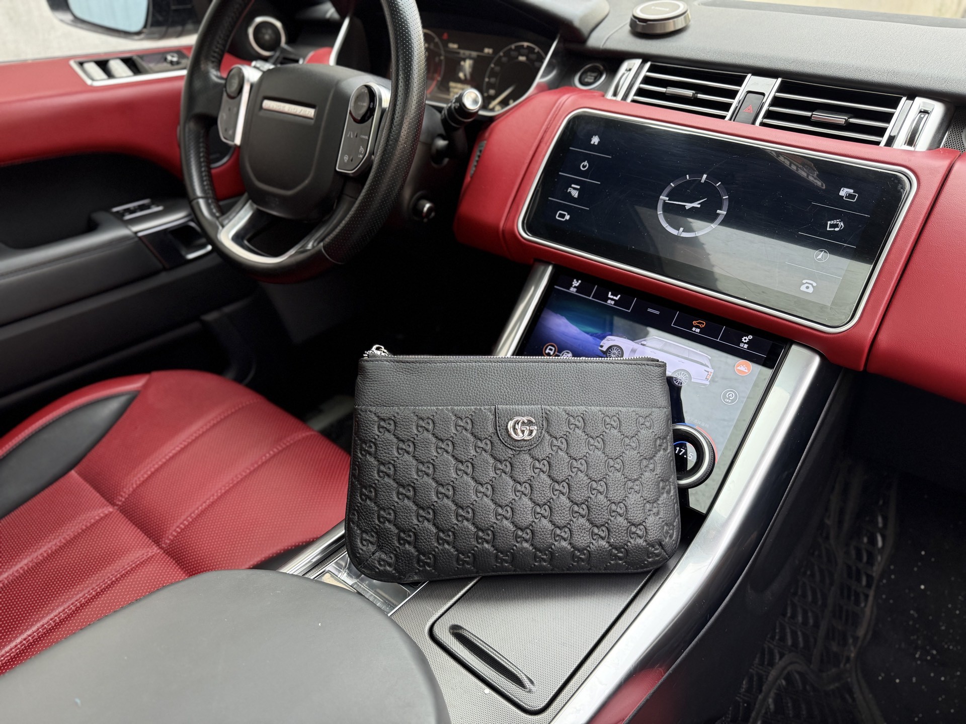 Gucci GG Embossed Leather Clutch