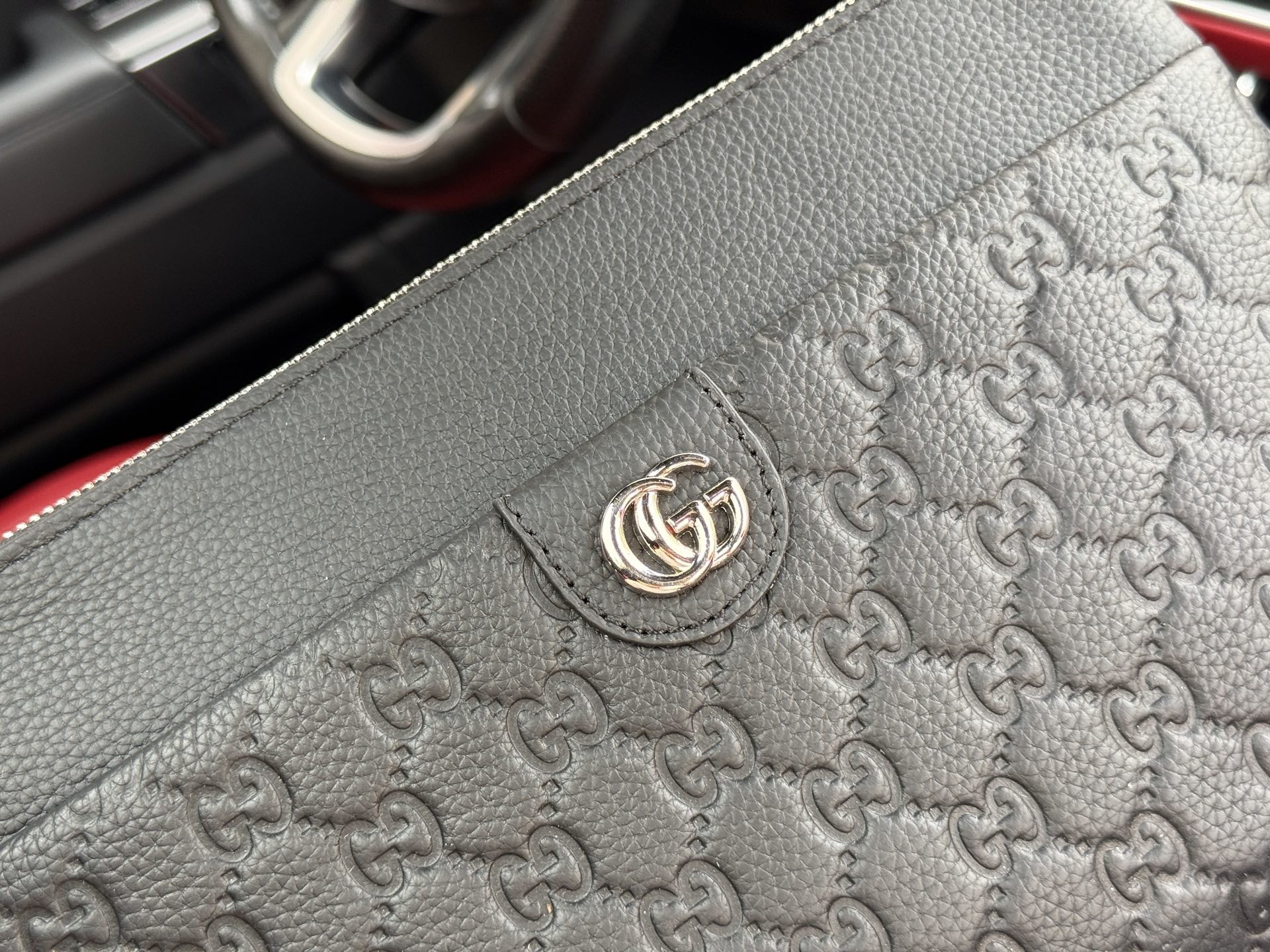 Gucci GG Embossed Leather Clutch