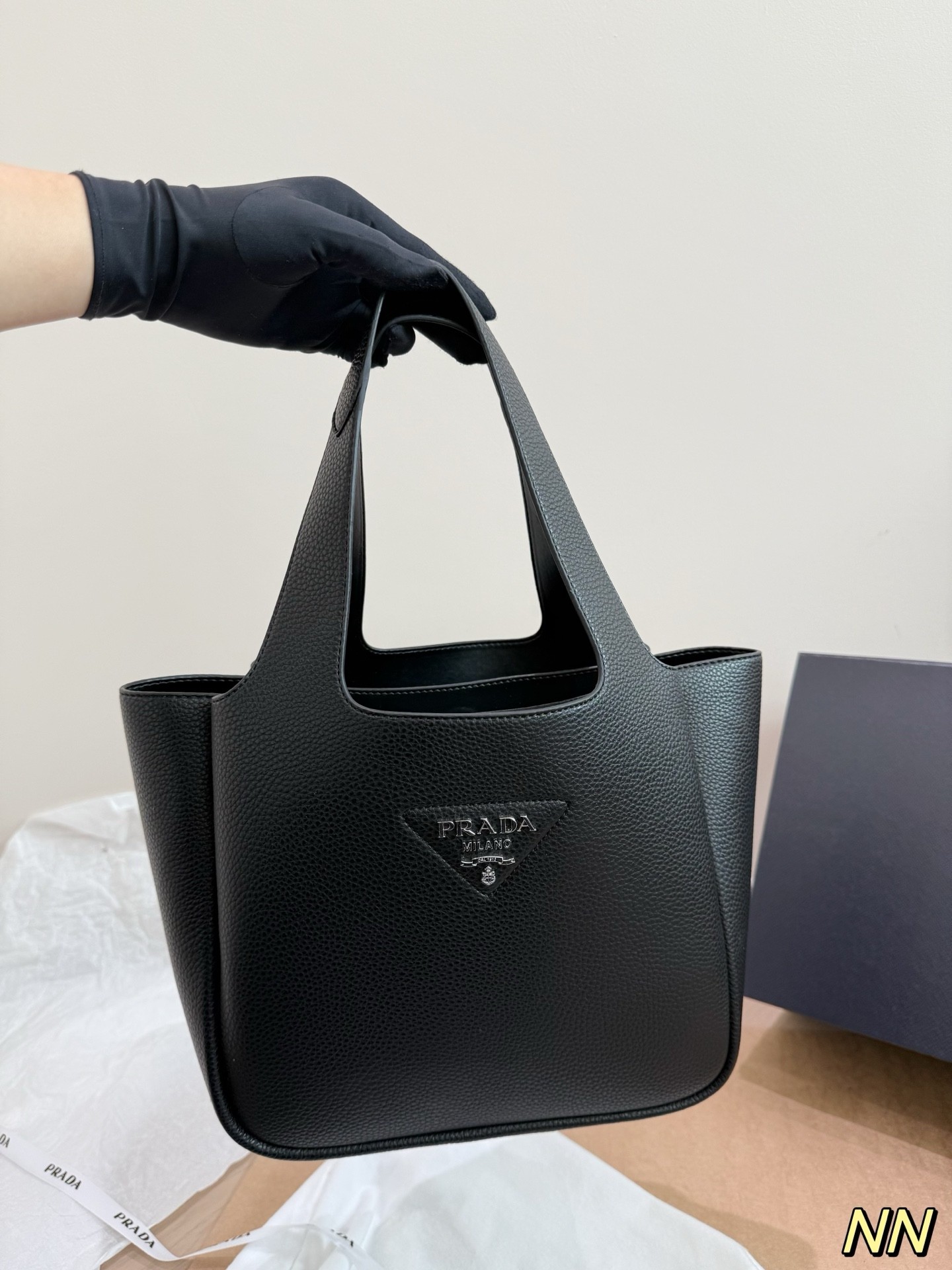 (Prada) black leather handbag