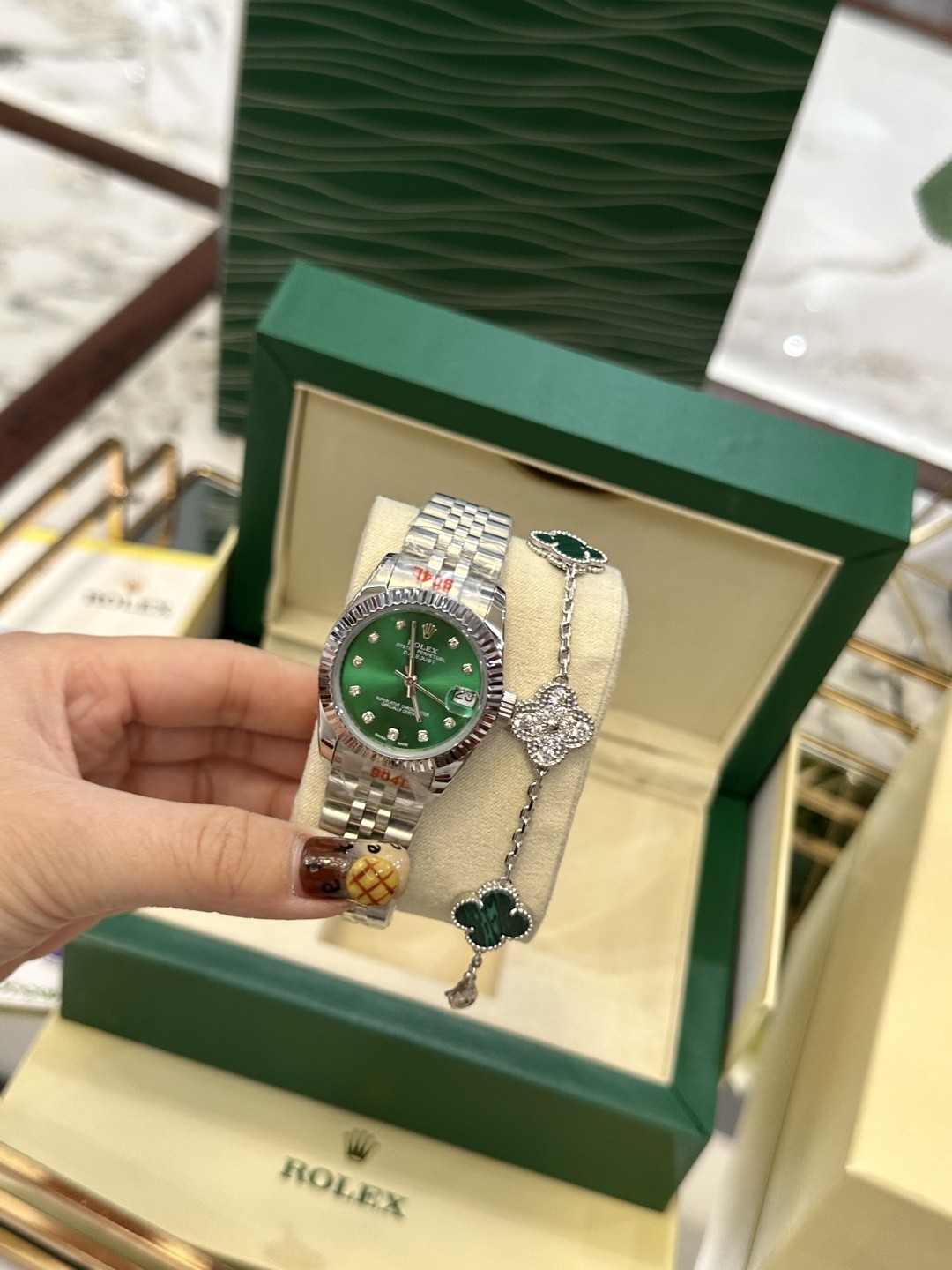 The Rolex watch is a Datejust model.