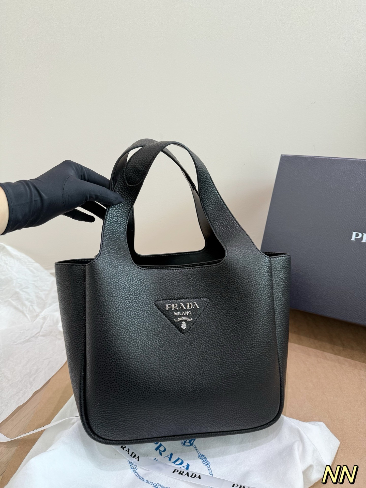 (Prada) black leather handbag