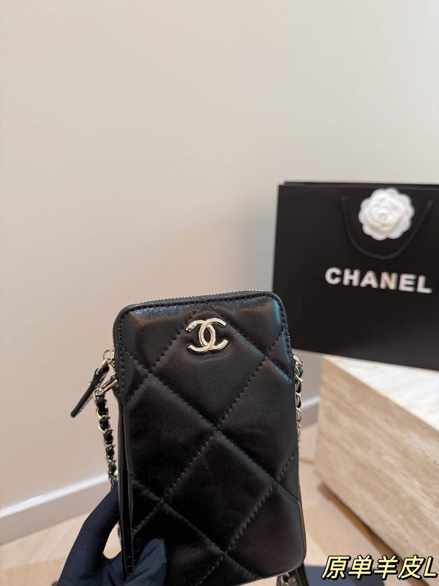 Chanel chain-strap phone case