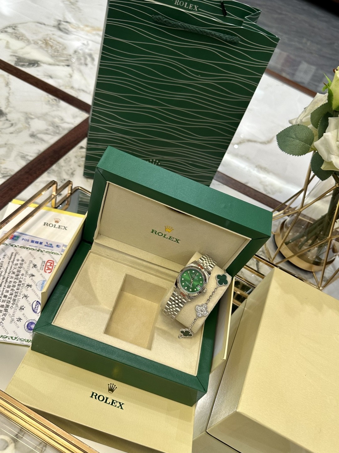 The Rolex watch is a Datejust model.