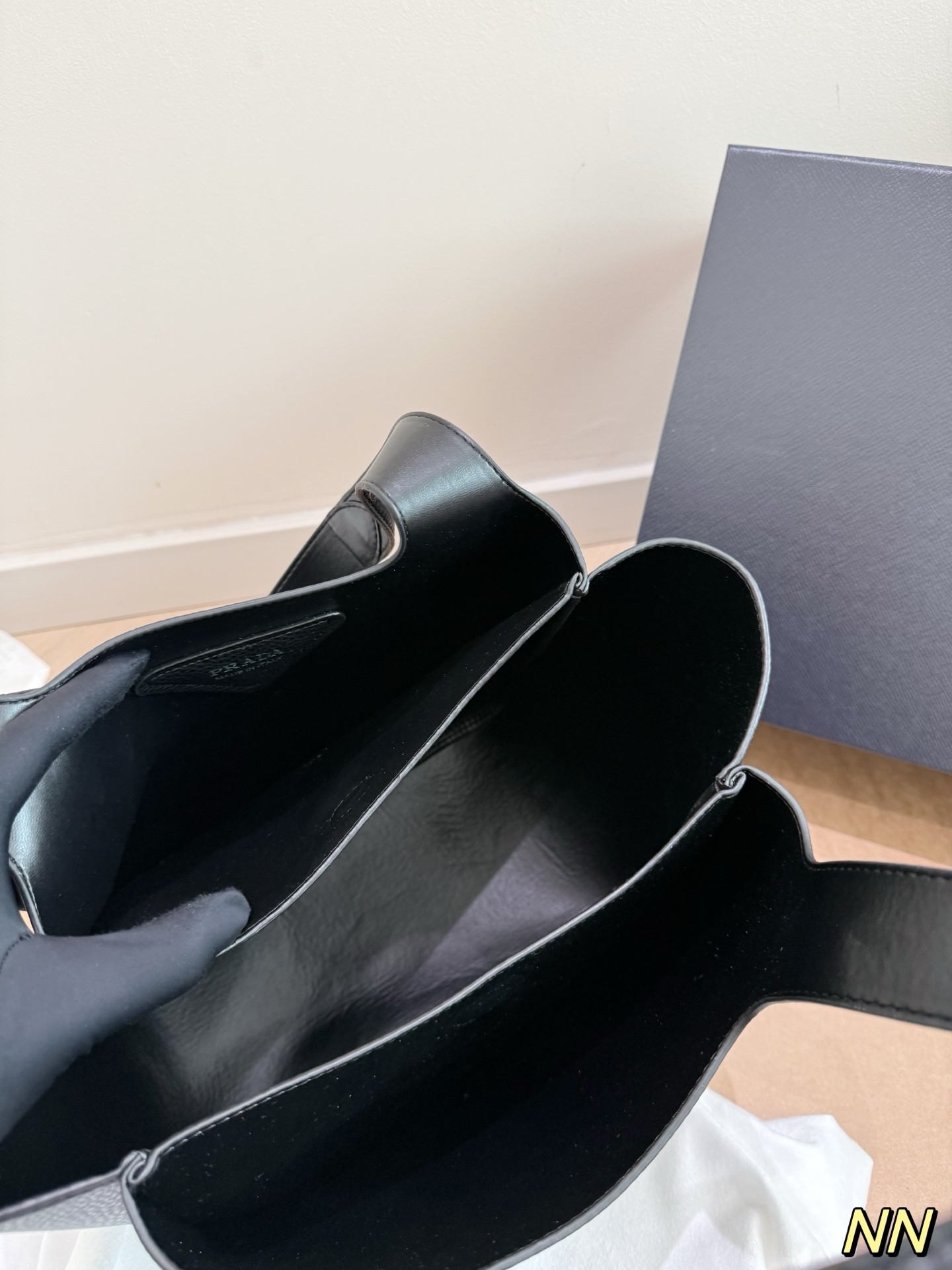 (Prada) black leather handbag